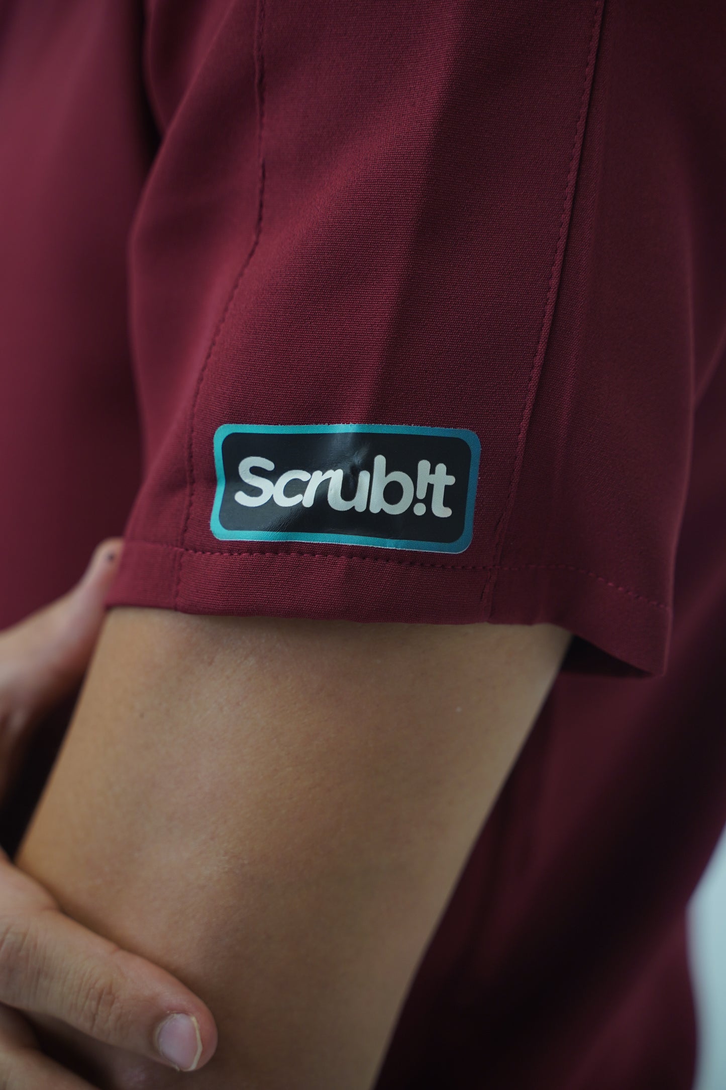 unparalleled scrub in light burgundy