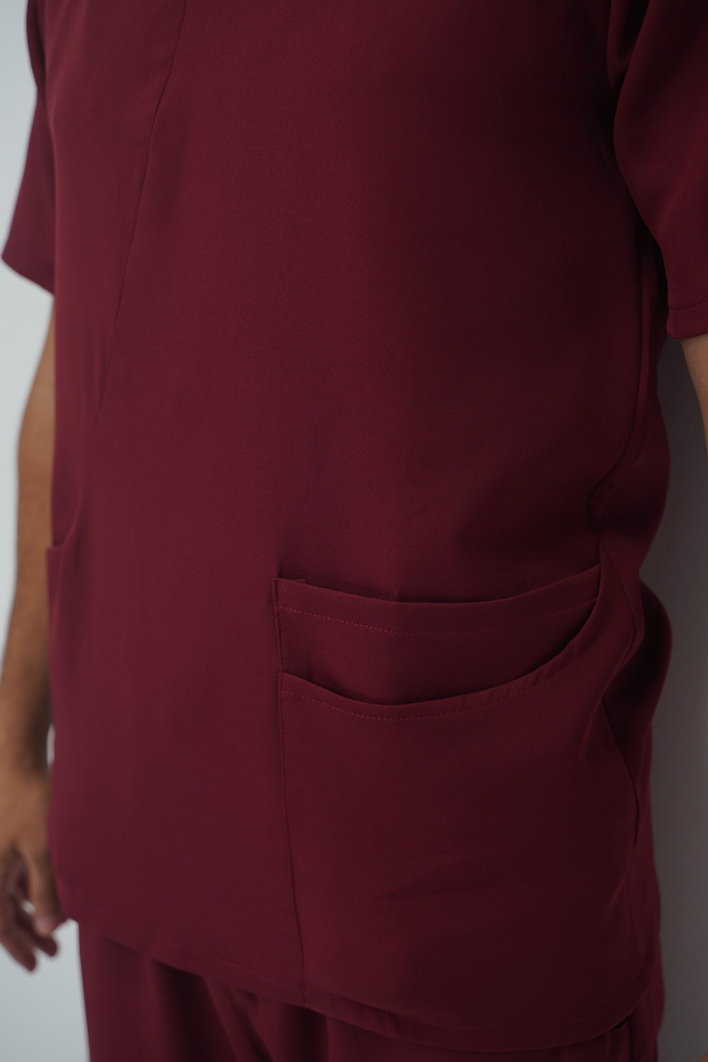 unparalleled scrub in light burgundy